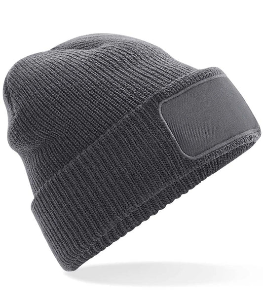 Gray knit beanie with a patch on a white background