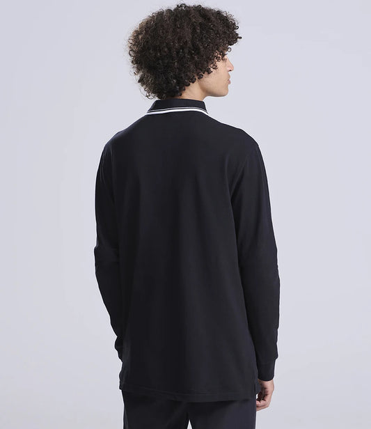 Person wearing a black long-sleeve shirt with a white collar on a light gray background