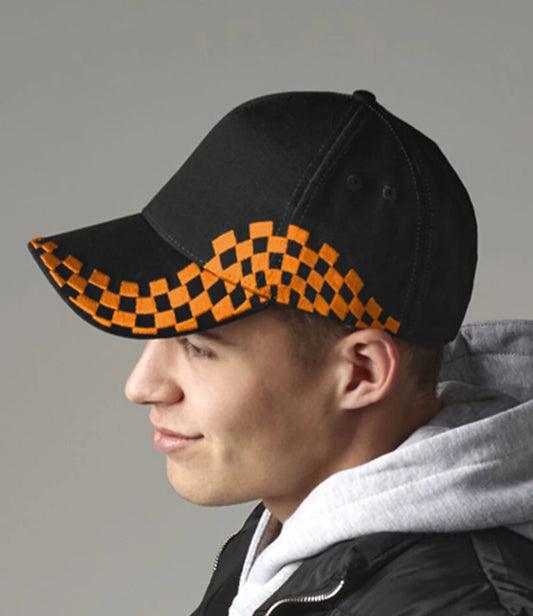 Man wearing a black cap with orange grand prix print