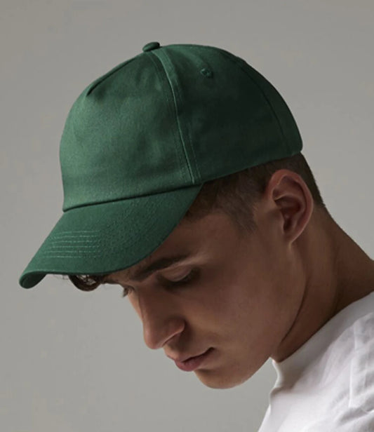 Person wearing a green cap against a plain background