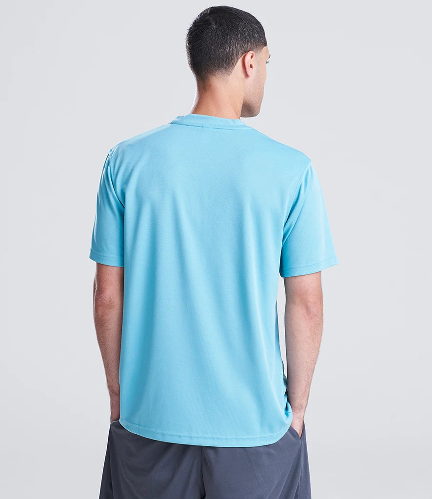 Man wearing a light blue t-shirt on a plain background