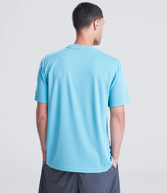 Man wearing a light blue t-shirt on a plain background