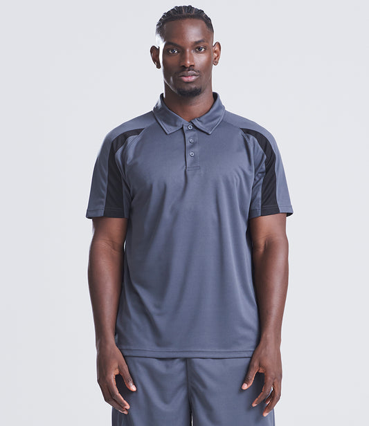Man wearing a gray polo shirt with black accents on a white background