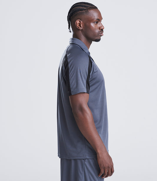 Man wearing a gray athletic outfit against a white background