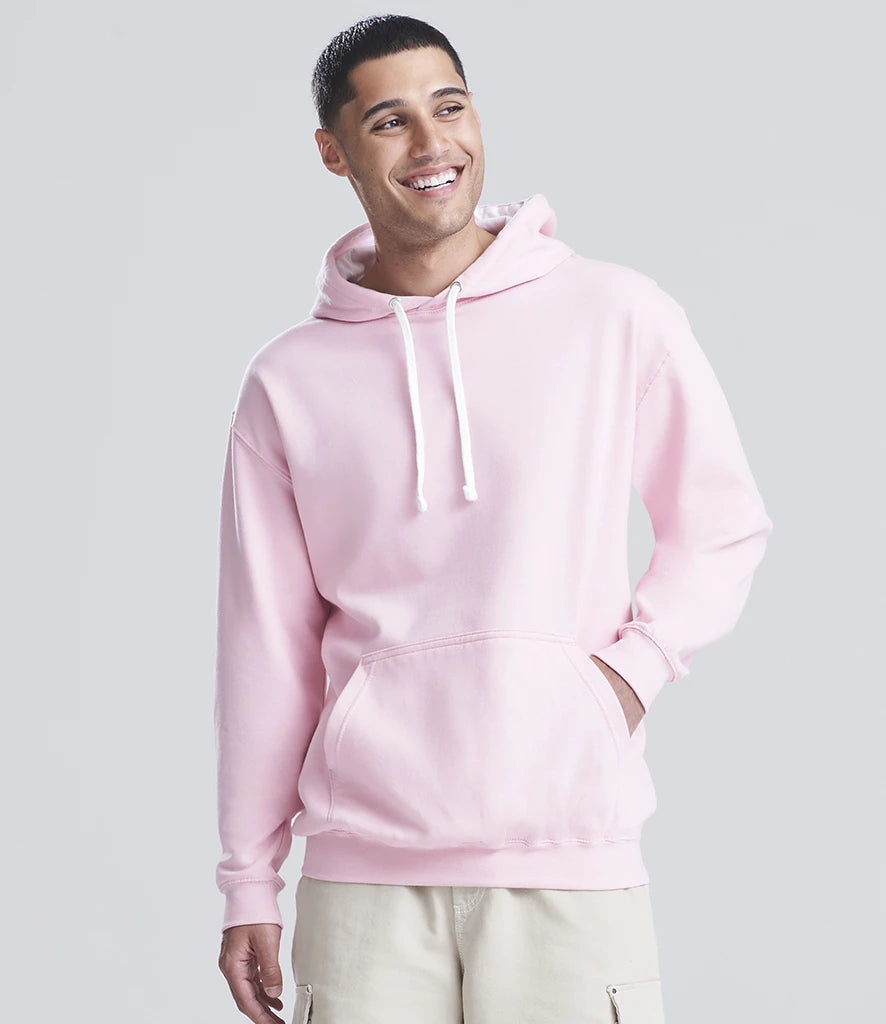 Person wearing a pink hoodie on a light gray background