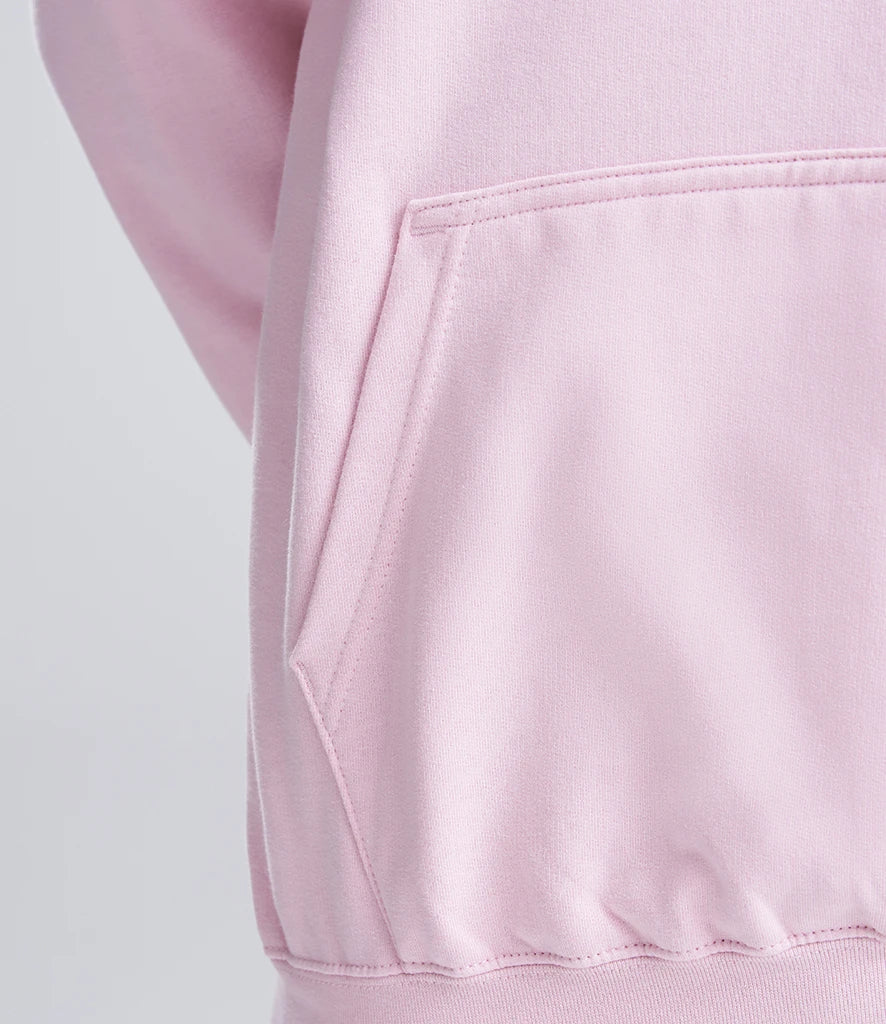 Close-up of a pink hoodie with a pocket on a light gray background