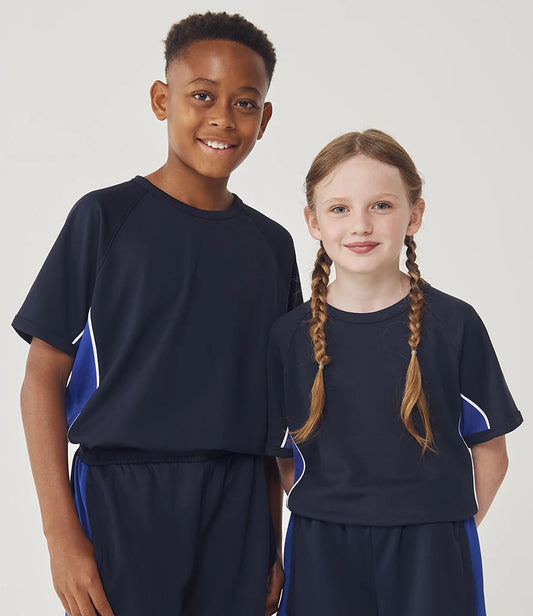 Two children wearing matching navy blue sports outfits with blue accents on a plain background.