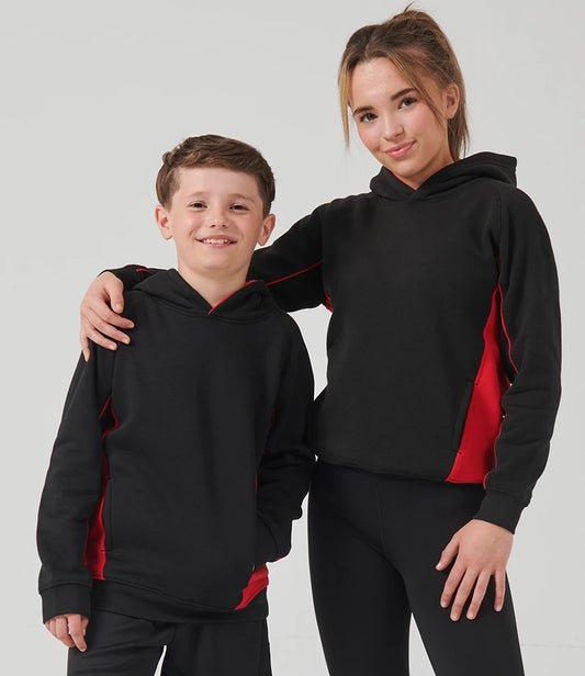 Two children wearing matching black and red hoodies on a plain background