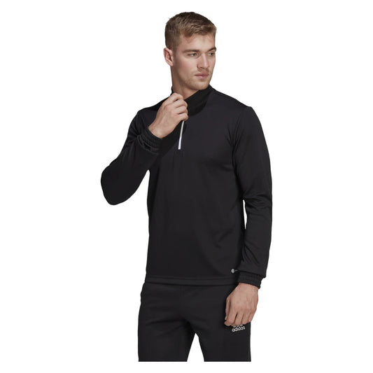 Man wearing a black adidas training top